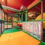 Colorful indoor playground for kids with slides and climbing structures